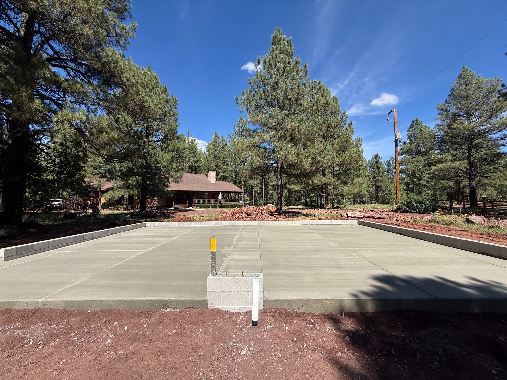 Finished concrete pad in a wooded Arizona setting